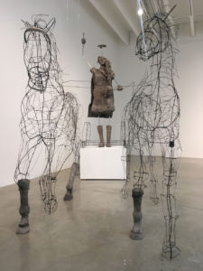 A sculpture by DCA Cultural Trailblazer Kristi Lippire. Two horses made of wire and steel pull a figure of a woman 