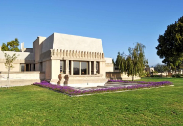Arts Resources During COVID-19. An architectural photograph of Frank Lloyd Wright's Hollyhock House on a sunny blue day