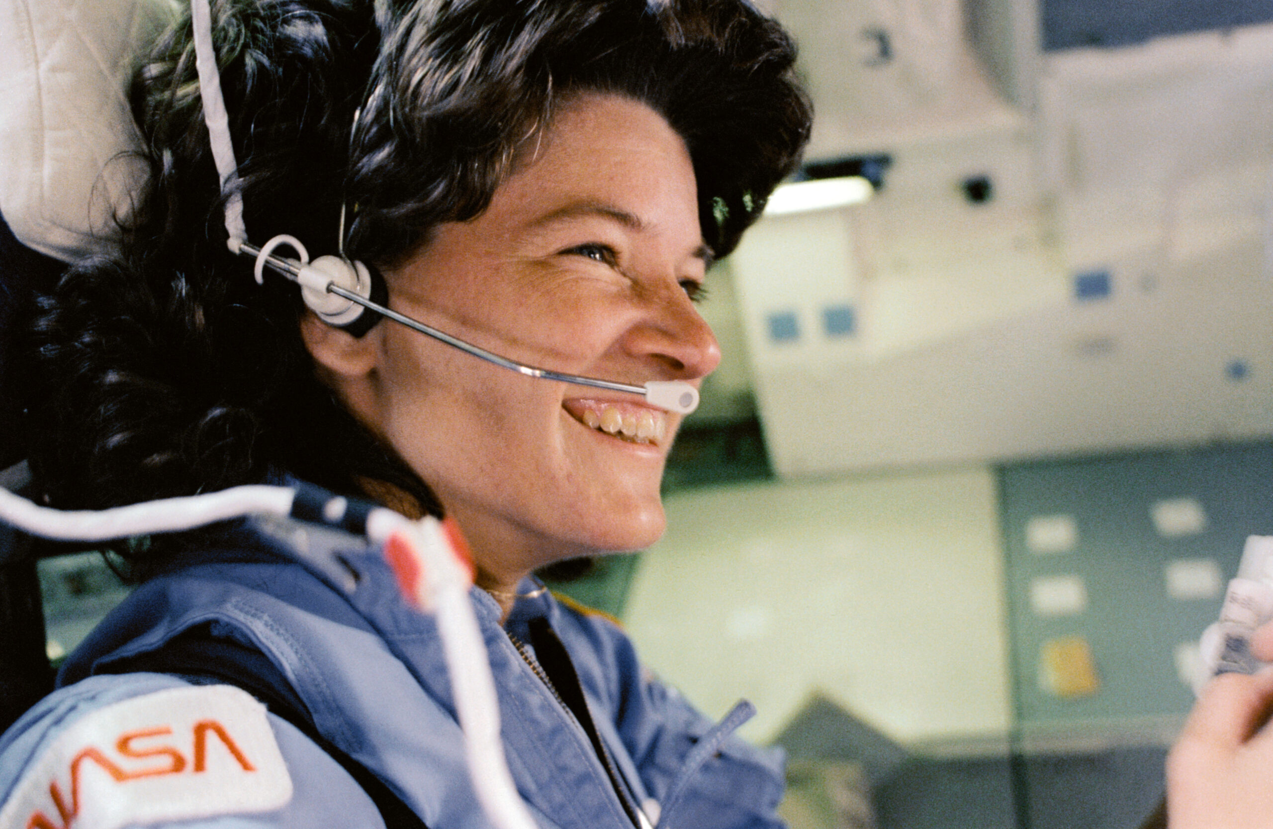 Image close up of Sally Ride, a caucasian woman with black hair seen smiling